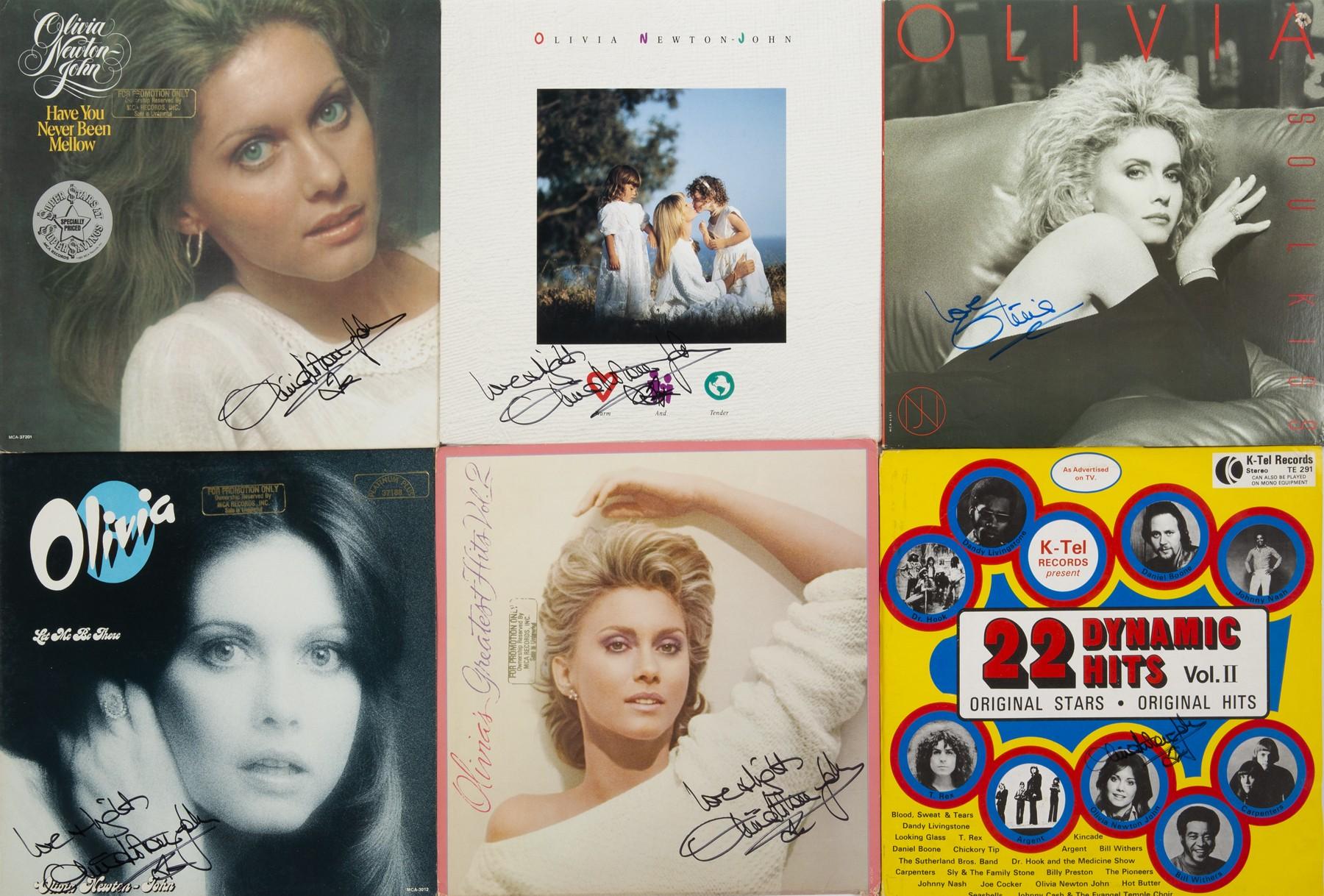 a collection of olivia oliver signed albums