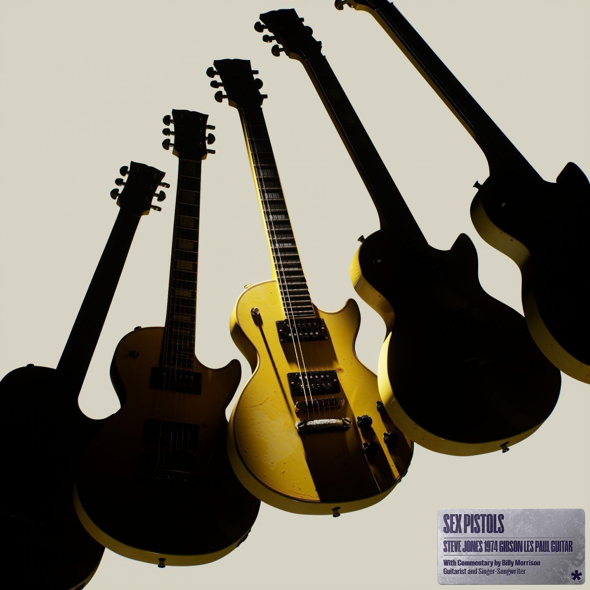 four electric guitars are lined up in a row on a white background .