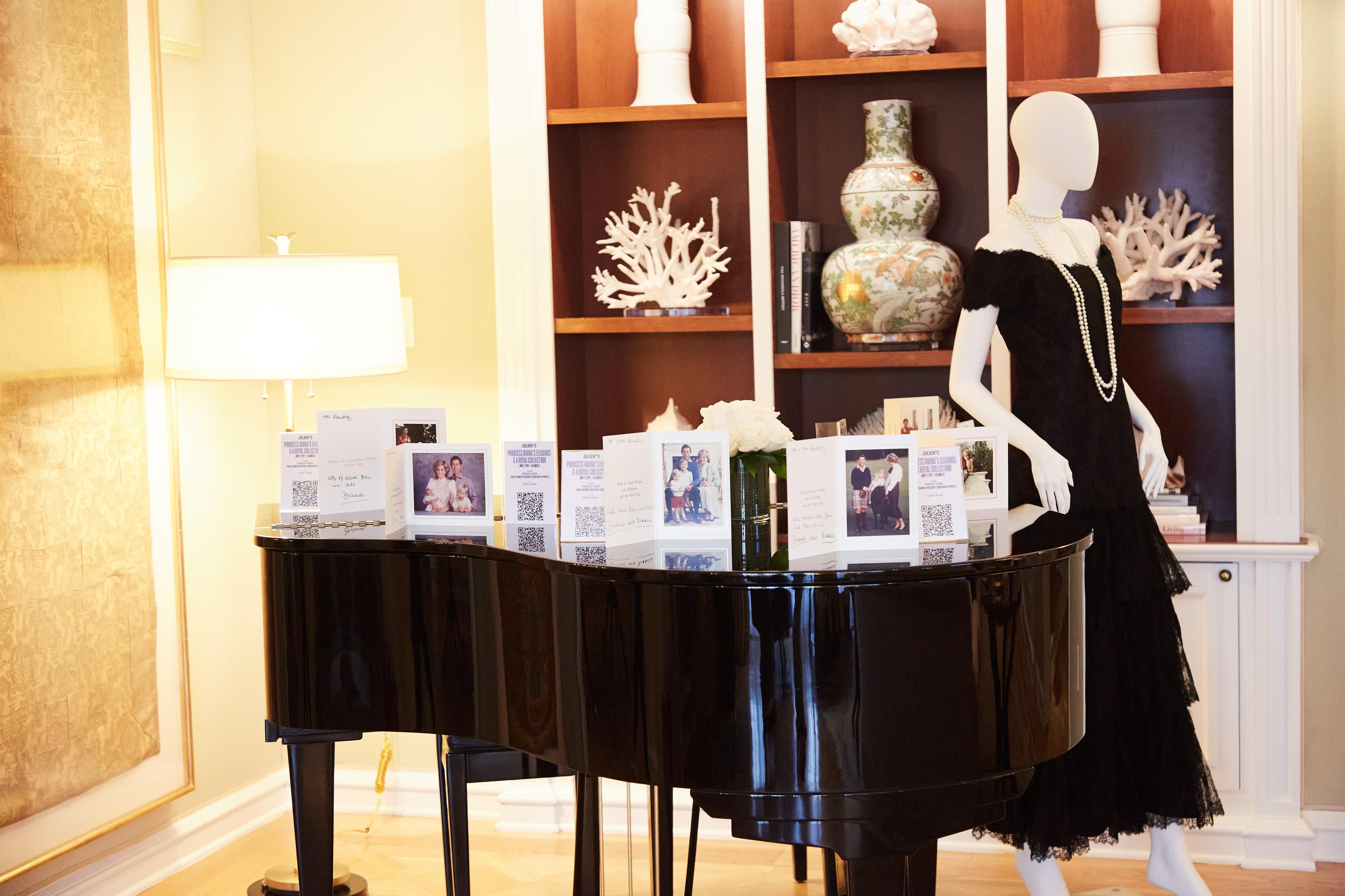 a mannequin is standing in front of a piano in a living room .