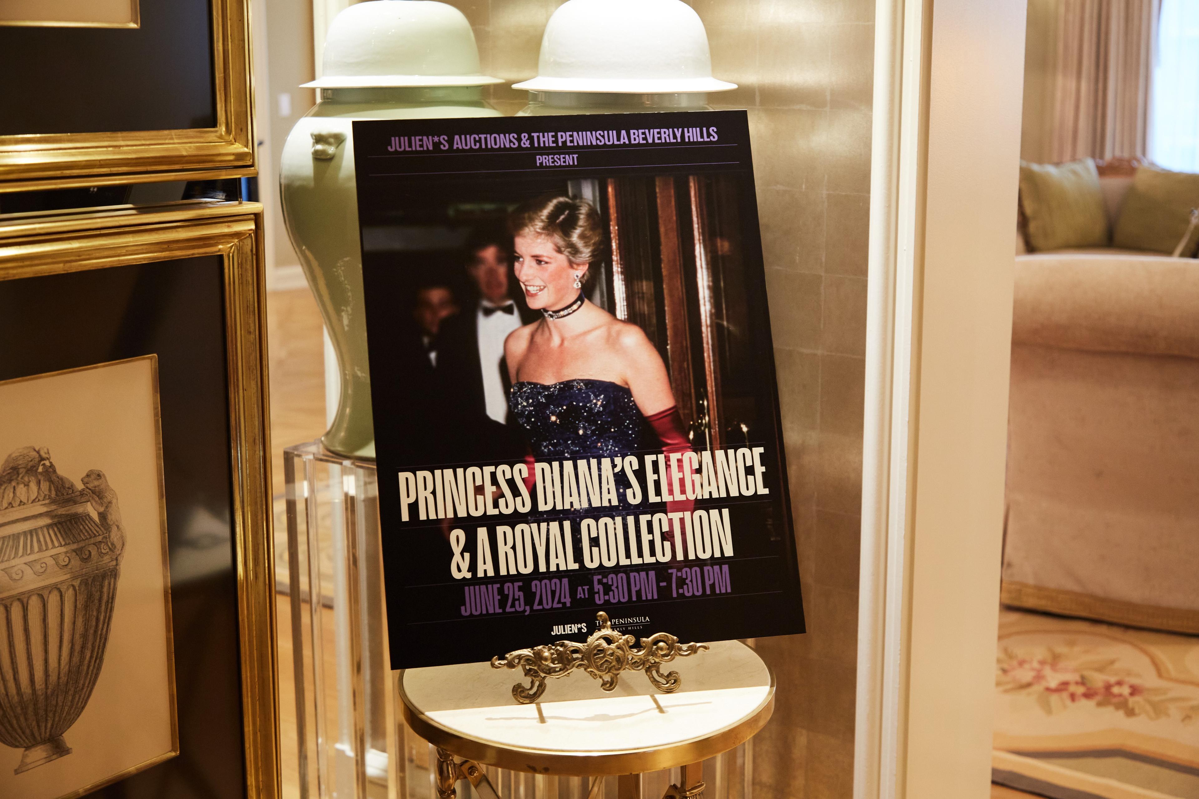 a poster of princess diana 's elegance and a royal collection is sitting on a table .