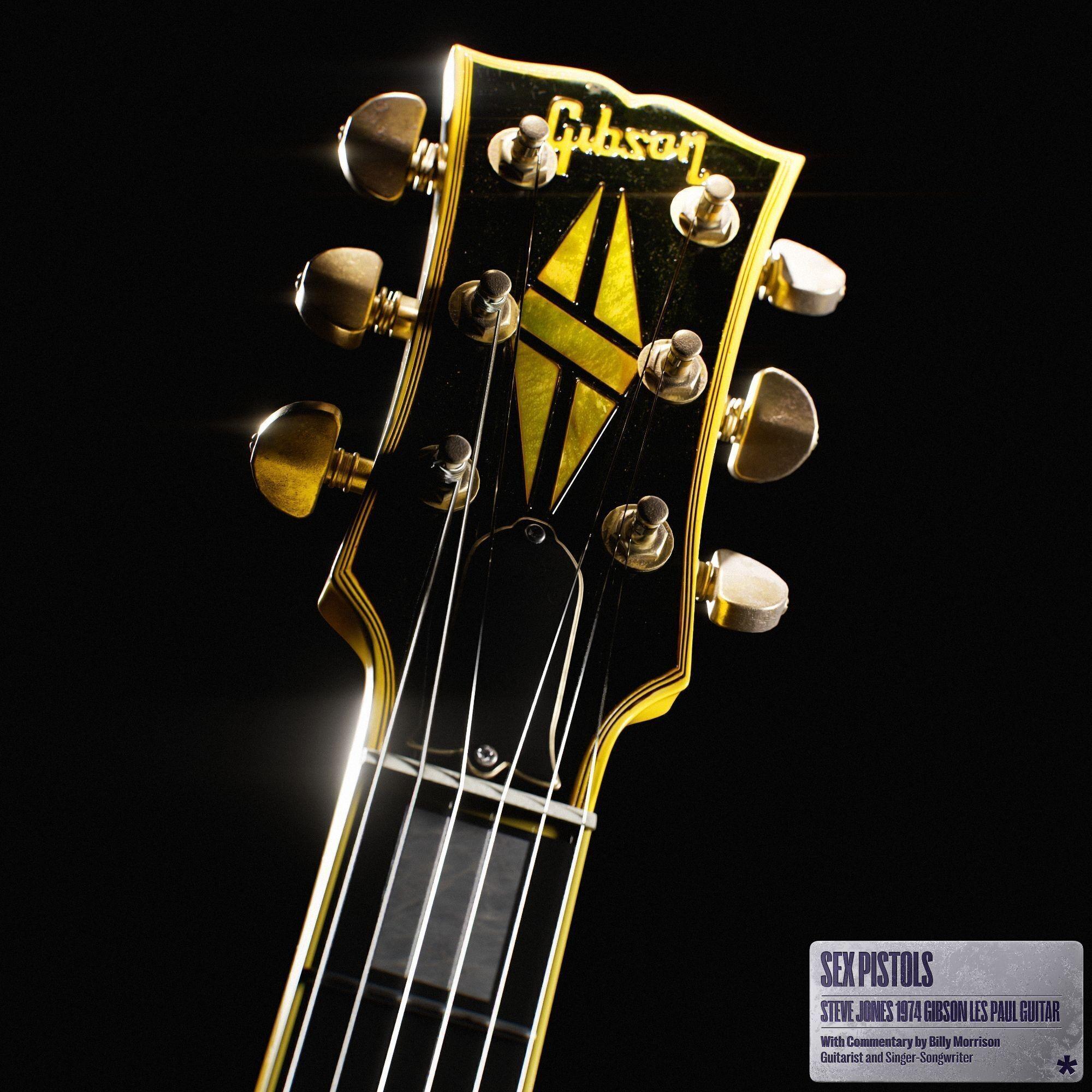 a close up of a gibson guitar headstock on a black background