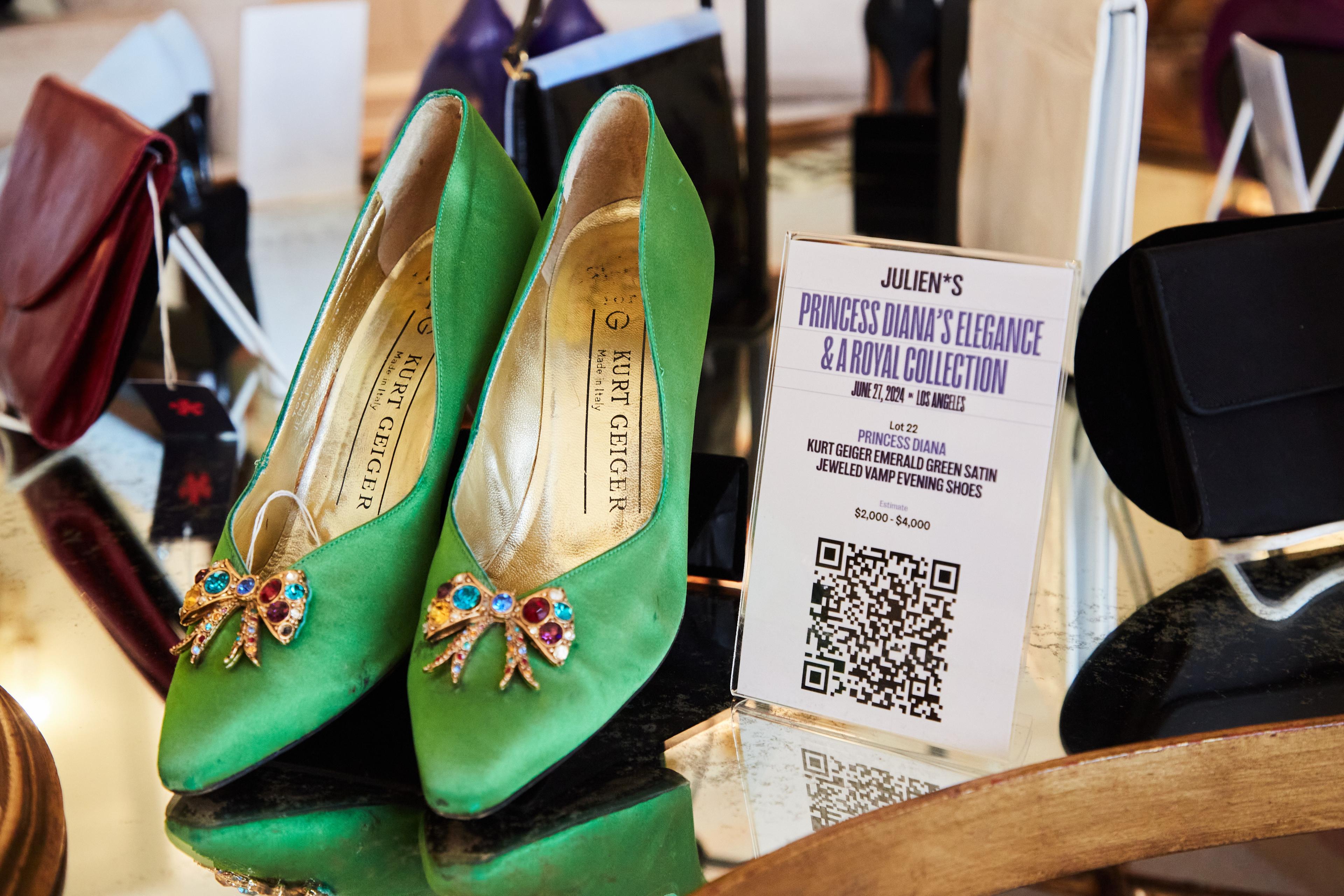 a pair of green shoes are on display in a store .