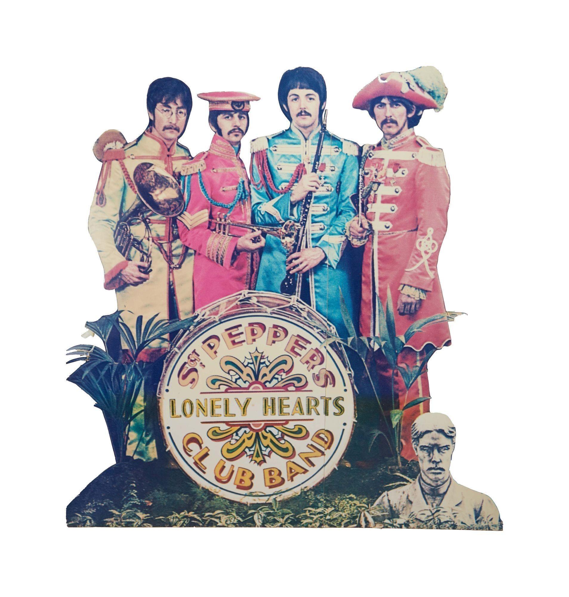a poster of the beatles ' lonely hearts club band